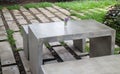 Concrete outdoor furniture set in the small garden