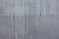 concrete outdoor wall with matte gray paint and black smudges - full-frame background and flat texture