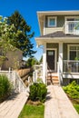 Concrete pathway to the entrance of brand new townhouse on sunny day in Canada. Royalty Free Stock Photo