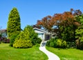 Concrete pathway to a family house on a sunny day in Canada Royalty Free Stock Photo