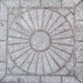 Concrete paver stone featuring simple sunburst