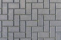 Concrete paving stones in grey during midday noon sunlight laid out in regular pattern texture Royalty Free Stock Photo