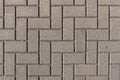 Concrete paving stones in grey during warm sunlight laid out in regular pattern texture Royalty Free Stock Photo