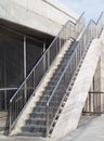 concrete pedestrian overpass stairs with stainless railings for walking along side of bridge Royalty Free Stock Photo