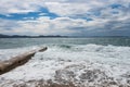 Concrete pier with a crashing wave in Zadar Croatia view at medieterranean sea Royalty Free Stock Photo