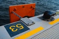 Concrete pier with yellow designations close up photo