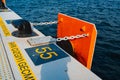 Concrete pier with yellow designations close up photo