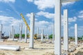 Concrete pillars of new edifice with a beautiful sky are placed Royalty Free Stock Photo