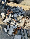 Concrete pillars among piles of construction debris