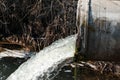 Concrete pipe transporting the poluted river Royalty Free Stock Photo