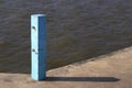 Concrete pole with chains hooks on jetty, Blue Jetty pole, Blue concrete pier pillars.