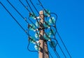 Concrete pole with electrical wires and high-voltage distribution insulators as part of a transmission line Royalty Free Stock Photo