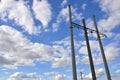 Concrete pole with wires of power line against the background of blue cloudy sk Royalty Free Stock Photo