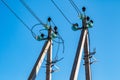 Concrete poles with electrical wires and high-voltage distribution insulators as part of a transmission line Royalty Free Stock Photo