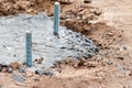 Concrete pouring and preparation of anchors for installation of a lighting column or a billboard. Concrete foundation Royalty Free Stock Photo