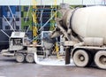 concrete pump and mixer to work together pouring cement floors in the shopping center for repair.