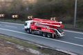 Concrete pump truck in motion on the british motorway M1