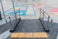 Concrete ramp way with stainless steel handrail  for support wheelchair disabled people. Ramp way to support wheelchair disabled p Royalty Free Stock Photo