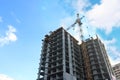 Concrete residential building under construction and crane Royalty Free Stock Photo