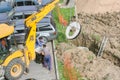 Concrete ring attached to the tractor bucket