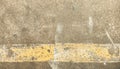 Concrete road surfaces and yellow traffic lines peeling off for background