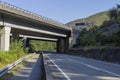 Concrete road viaduct over an empty highway in Spain.