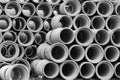 Concrete round pipes stacked. Black and white.
