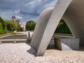 The concrete, saddle-shaped monument of the Memorial Cenotaph at the Hiroshima Peace Memorial Park in Hiroshima, Japan