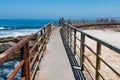 Concrete Sea Wall with Railing at La Jolla Children`s Pool Royalty Free Stock Photo