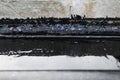 Concrete seam waterproofing with bitumen Royalty Free Stock Photo