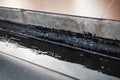 Concrete seam waterproofing with bitumen Royalty Free Stock Photo