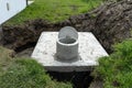 Concrete septic tank with a capacity of 10 cubic meters placed in the garden by the house, visible water below. Royalty Free Stock Photo