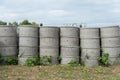 Concrete septic tanks stacked outdoors.