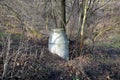 Concrete sewer manhole high above the ground with a bevelled neck. cylindrical rings with a lid invite children to explore. risk o