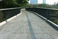 Concrete skywalk in the forest park. Royalty Free Stock Photo