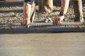 A concrete slab being leveled or screeded. Royalty Free Stock Photo