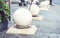 Concrete spheres prohibiting parking barrier on the street in Catania, Sicily, Italy Royalty Free Stock Photo