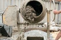 Concrete mixer in blurry motion mixes expanded clay with cement