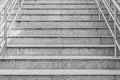 Concrete staircase with metallic handrail