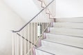 Concrete staircase with metallic handrail