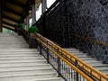 Concrete staircase with wooden railing. Bottom view Royalty Free Stock Photo