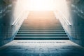 Concrete stairs leading up towards light. Concept of hope and bright future. Royalty Free Stock Photo