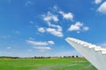 Concrete stairs in the middle of the rice paddy field with the view of clear blue sky