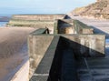 Concrete stairs on seawall in blackpool with the beach at low tide in sunlight Royalty Free Stock Photo