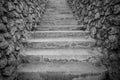 Concrete stairs between stone walls in black and white Royalty Free Stock Photo