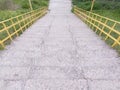 Concrete stairs with yellow handrail stairs going down Royalty Free Stock Photo