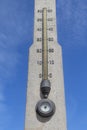 Concrete stella on the beach with a thermometer and a barometer Royalty Free Stock Photo