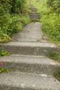 Concrete steps and overgrown uphill path. Royalty Free Stock Photo