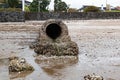 Concrete stormwater pipe draining rain water into sea Royalty Free Stock Photo