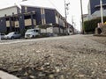 A concrete street view looking up at houses